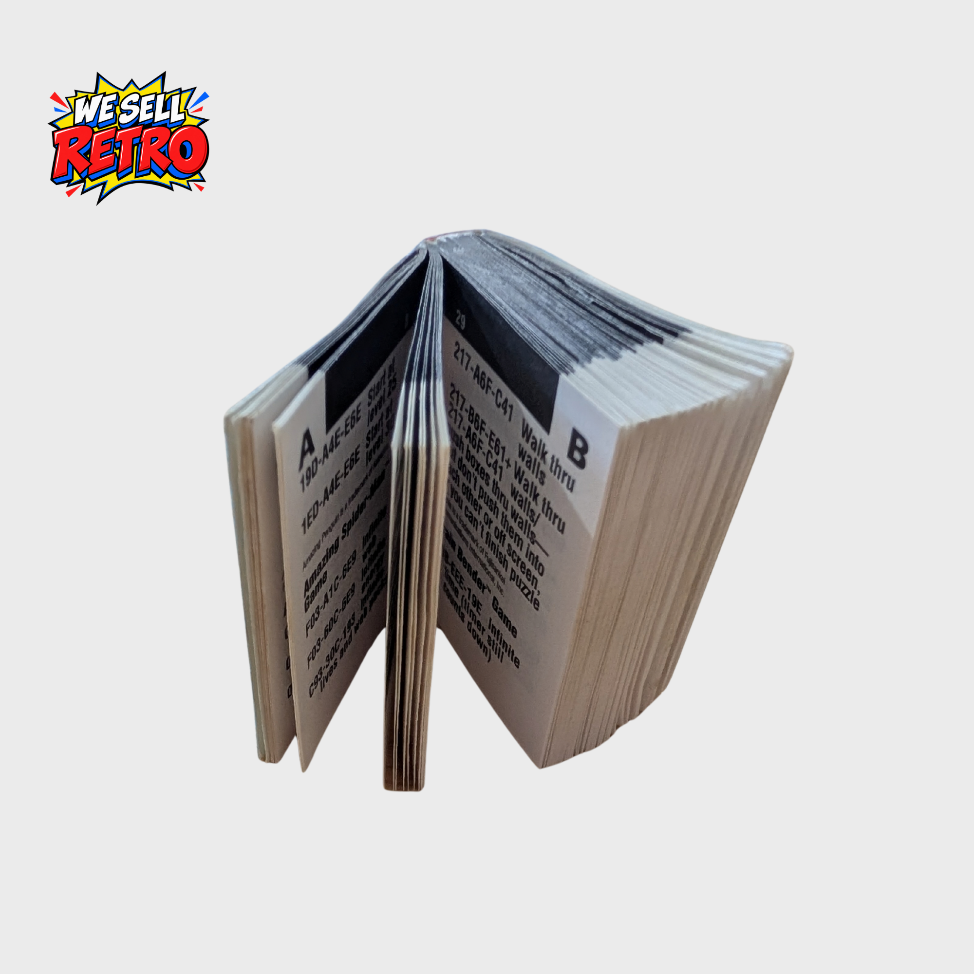 Galoob Game Genie for Nintendo Game Boy – With Programming Manual and Codebook Open pages of the Game Boy Game Genie Programming Manual and Codebook