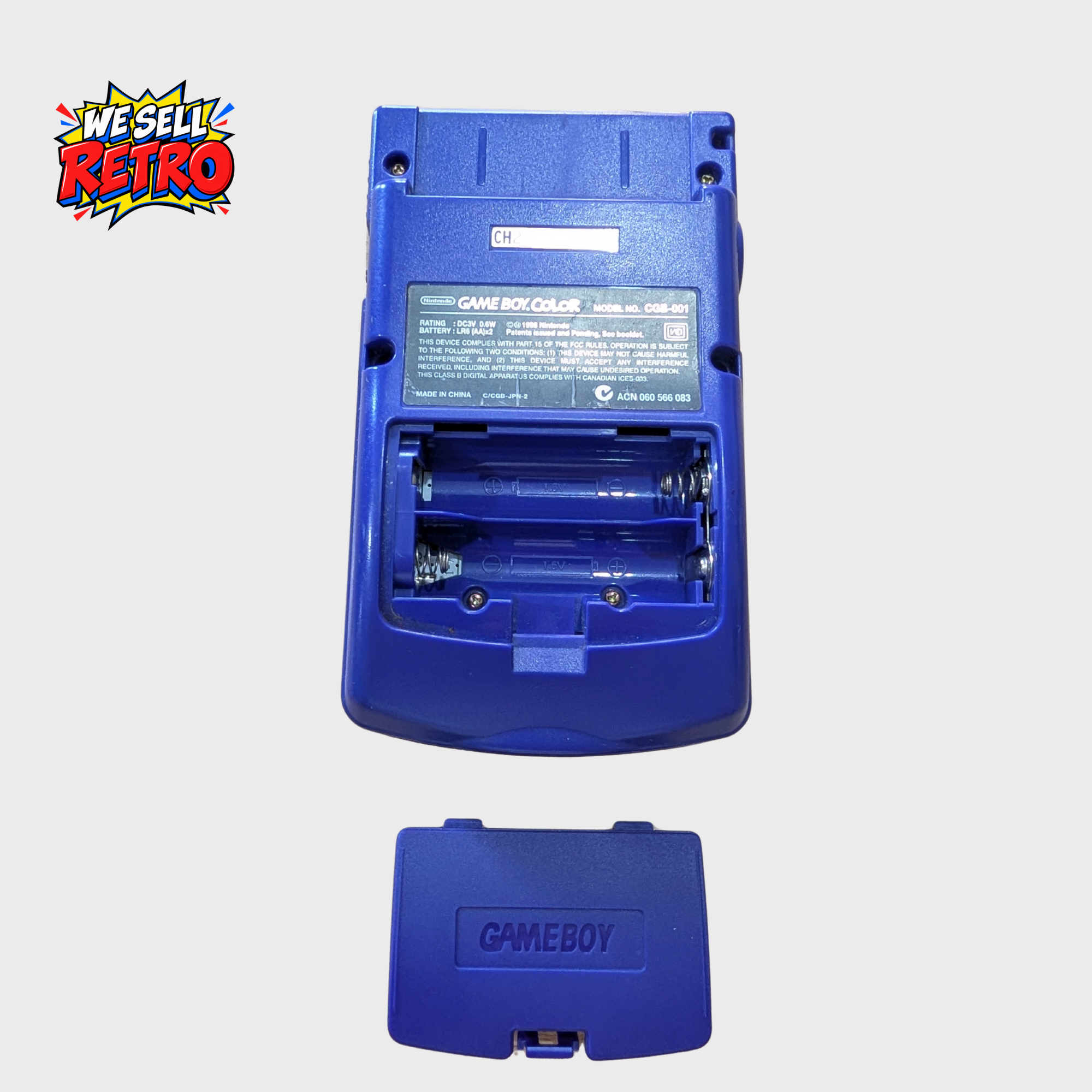 Nintendo Game Boy Color CGB-001 – Grape Purple – Tested and Working Nintendo Game Boy Color CGB-001 – Grape Purple battery compartment with cover removed beside console