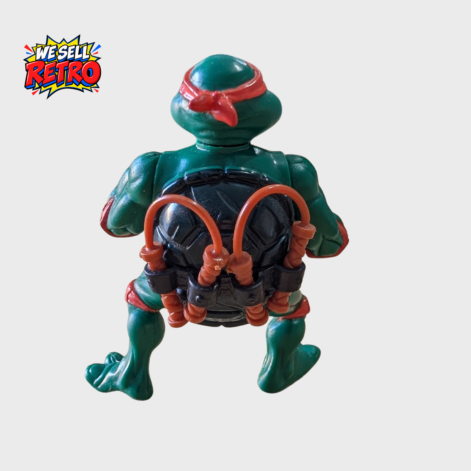 Michelangelo Vintage TMNT Action Figure – Teenage Mutant Ninja Turtles Rear view of vintage Playmates TMNT Michelangelo action figure with nunchucks stored in his belt